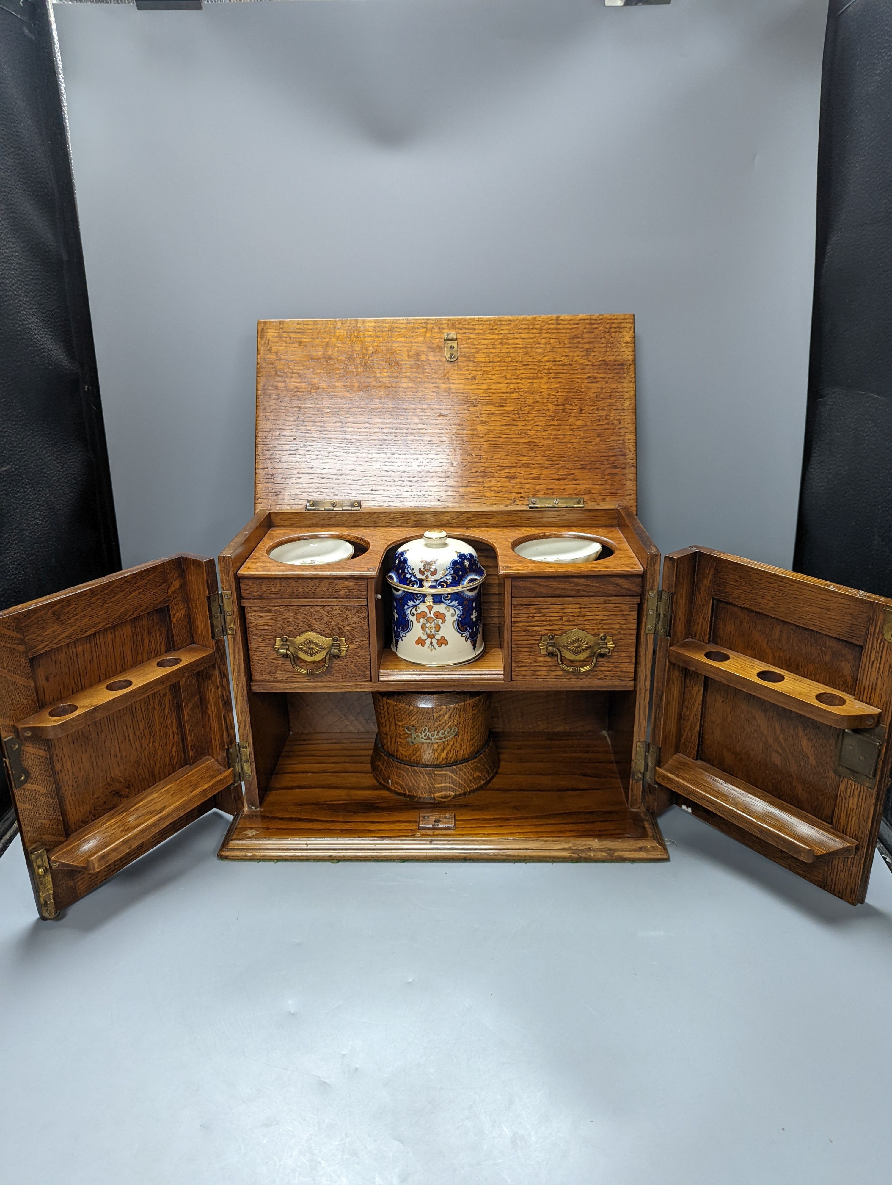 A carved oak smoker's cabinet 38cm